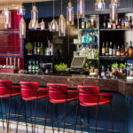 The Brasserie Bar at Mercure Swansea Hotel, red bar stools, blue bar, glass light fixtures