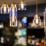 Blurred close up of glass light fixtures in the bar at Mercure Swansea Hotel