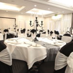 Lakeside Suite at Mercure Swansea Hotel set up for a wedding with black and white decoration.