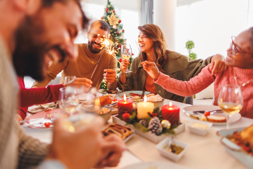 Group,Of,Cheerful,Young,Friends,Having,Christmas,Dinner,Together,At Work colleges partying